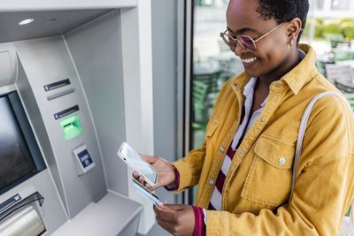 Woman using an ATM